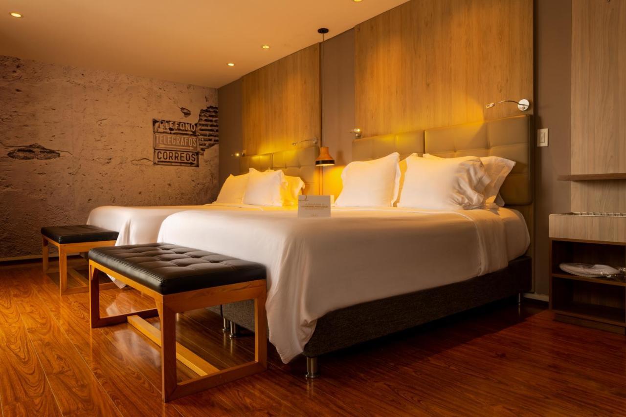 Quo Quality Hotel มานิซาเลส ภายนอก รูปภาพ A bedroom at the hotel
